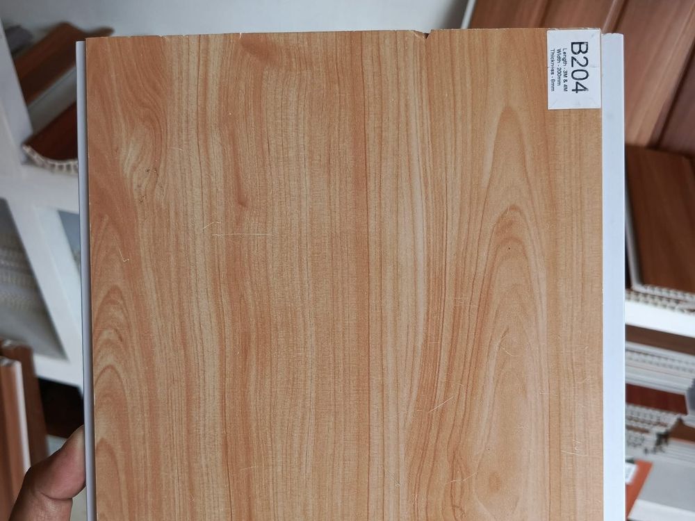 Close-up light wood-grain ceiling panel finish